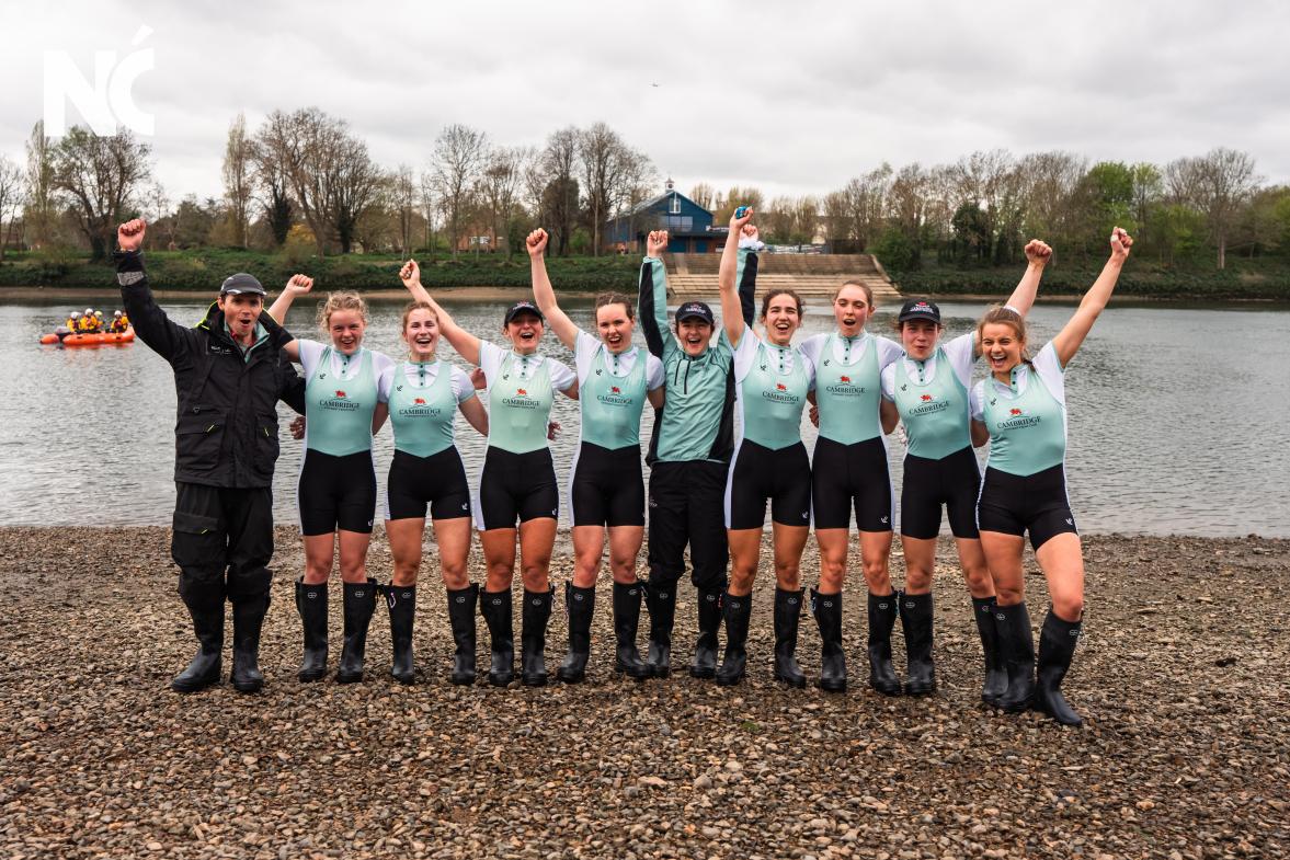 The team celebrates on the bank. Hannah is fourth from the right. 