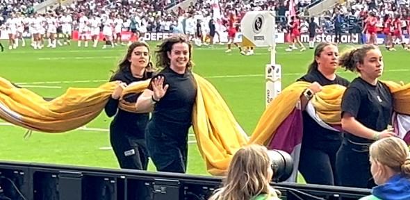 Jess McConnell bearing the flag at the Women's Rugby World Cup Final. Taken by Nathan Pitt. 