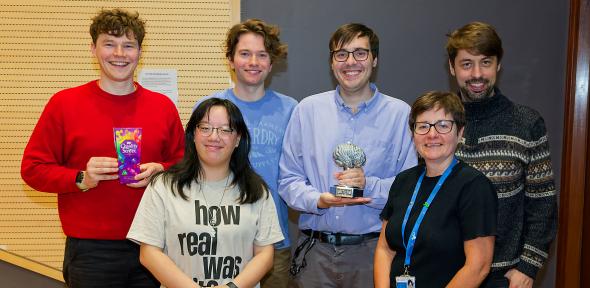 : The winners are in the backrow from left: Matthew Cotton, Brendan Cullinane (Captain), Daniel Heraghty and Georg Meisl. The quiz organisers are in the front row from left: Emma Solaas and Kathleen Pickett.